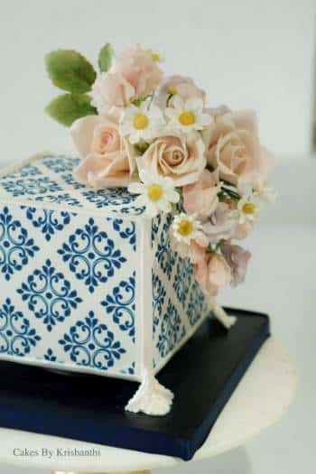 Square hand-painted celebration cake with sugar flowers