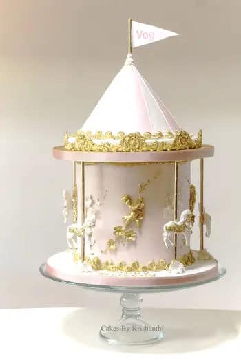 White and gold carousel cake